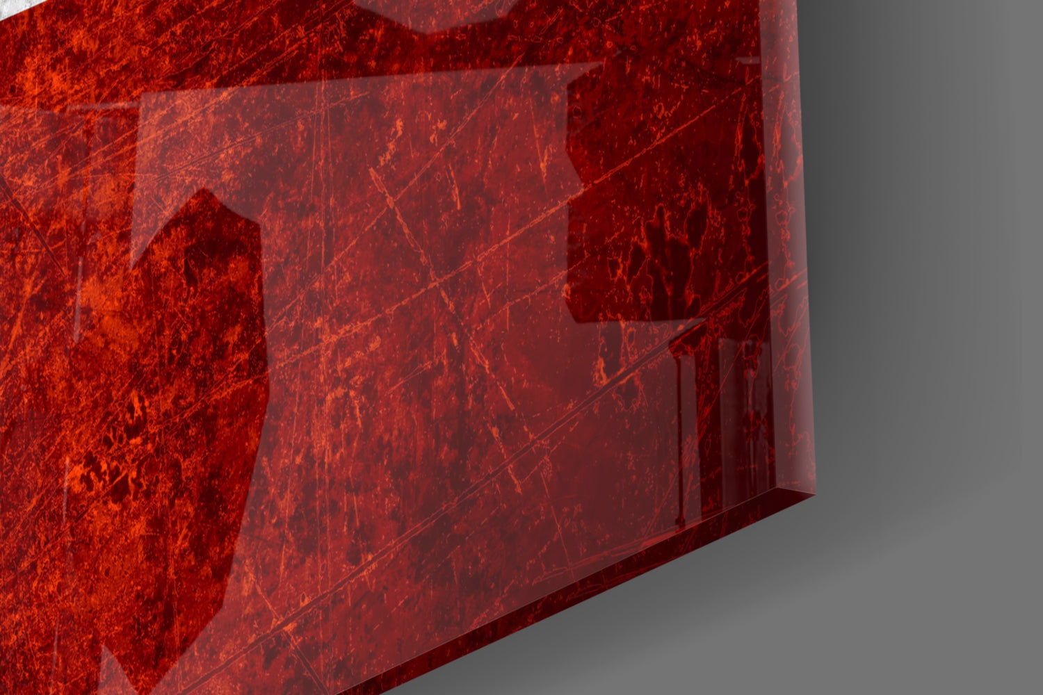 Close-up angled view of red translucent glass wall art with Austrian flag design, showing texture and light transmission.