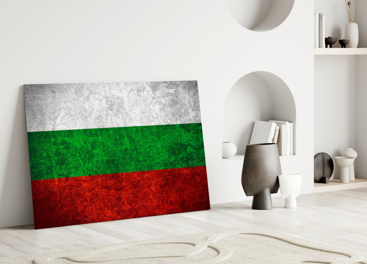 Bulgarian flag glass wall art leaning against white wall in minimalist interior with decorative objects.