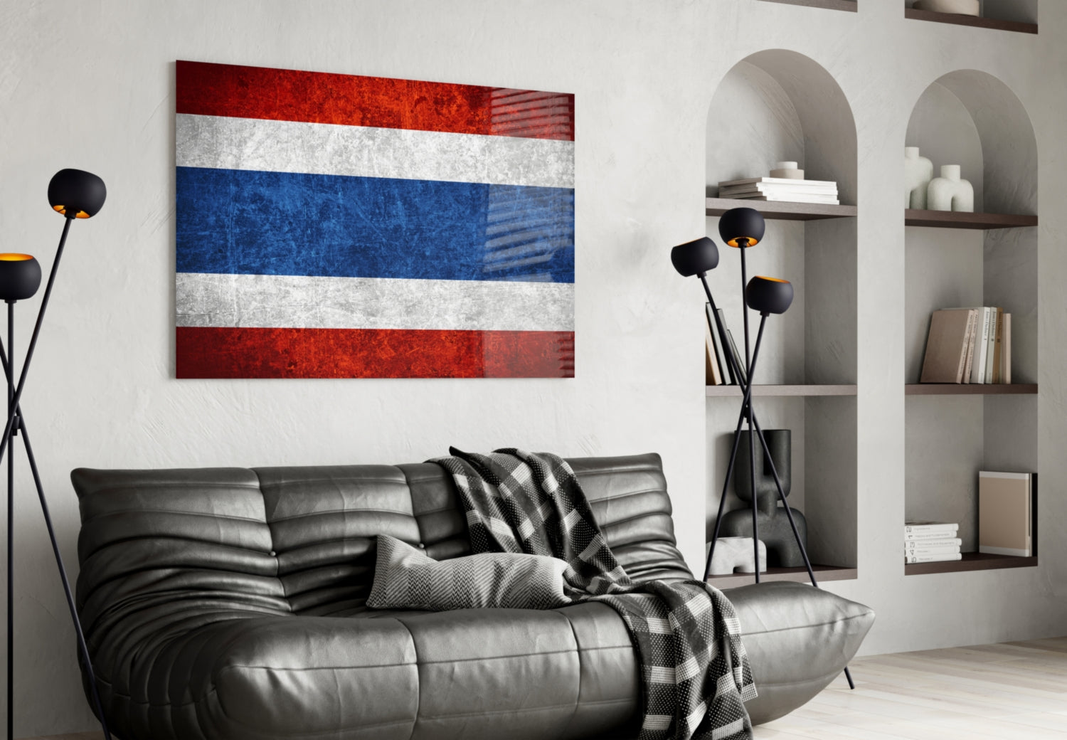 Thai flag glass wall art with red, white, and blue horizontal stripes displayed above black leather sofa in modern living room.