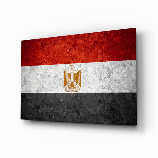 Egyptian flag glass wall art displaying red, white, and black horizontal stripes with gold eagle emblem, angled three-quarter view.