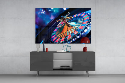 Colorful roulette wheel glass art displaying on gray media console in modern living room setting.