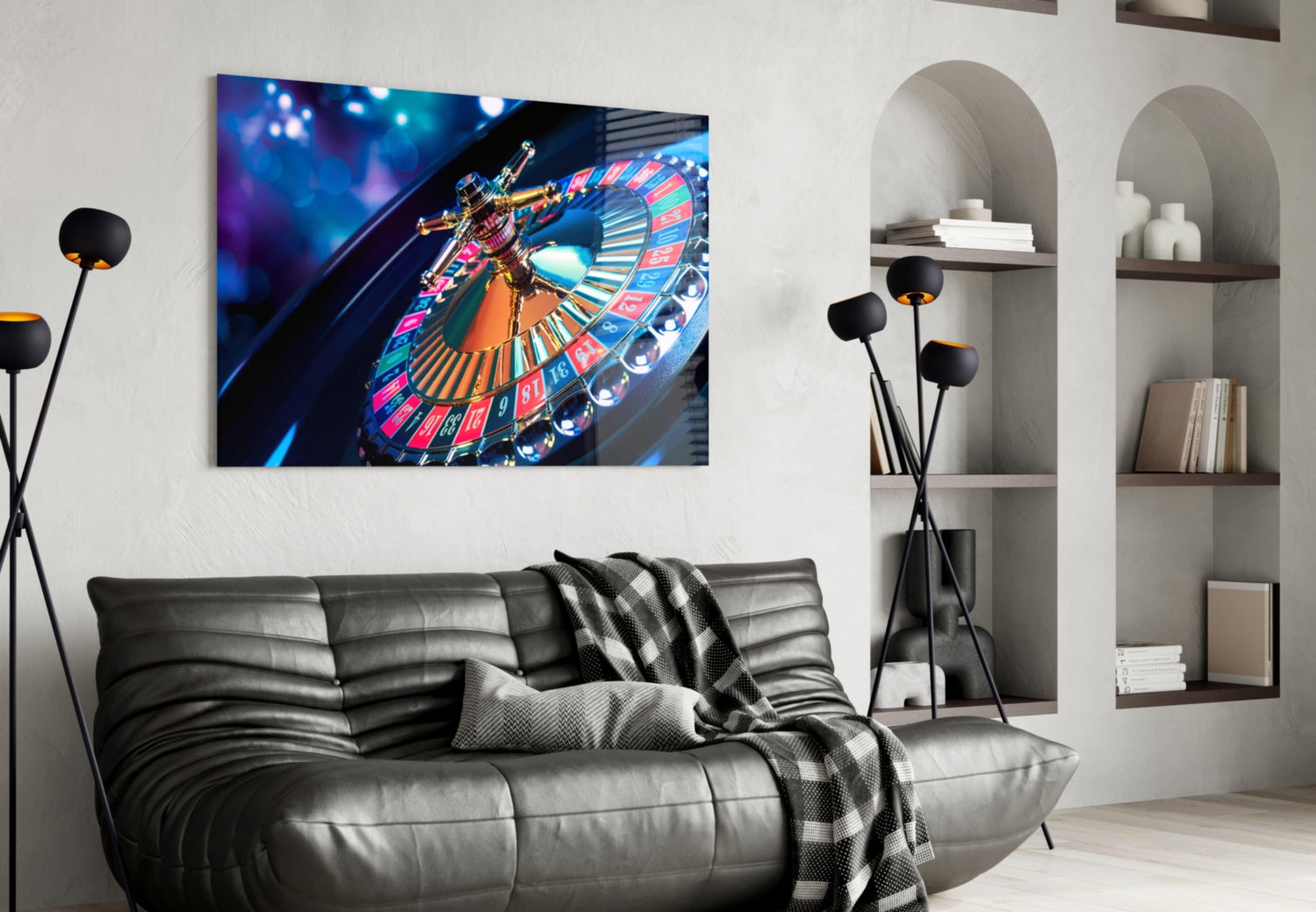 Roulette glass wall art mounted above black leather sofa in modern living room with arched shelving and floor lamps.
