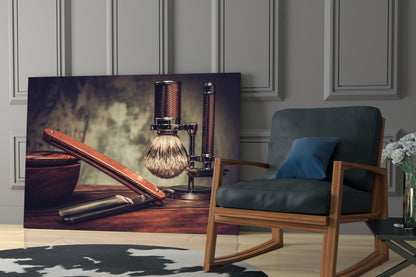 Vintage Shave Glass Wall Art displayed in modern living room with wooden chair, showing shaving brush and razors on warm wood tones.