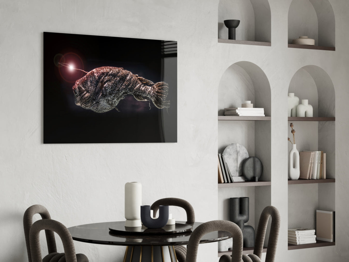 Deepsea fish glass wall art mounted above black dining table, featuring glowing fish against dark background with red light source.