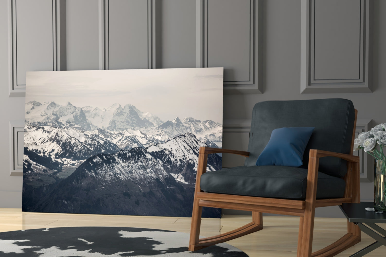 Snowy Mountains Glass Wall Art displayed on floor next to mid-century wooden chair in modern interior setting.