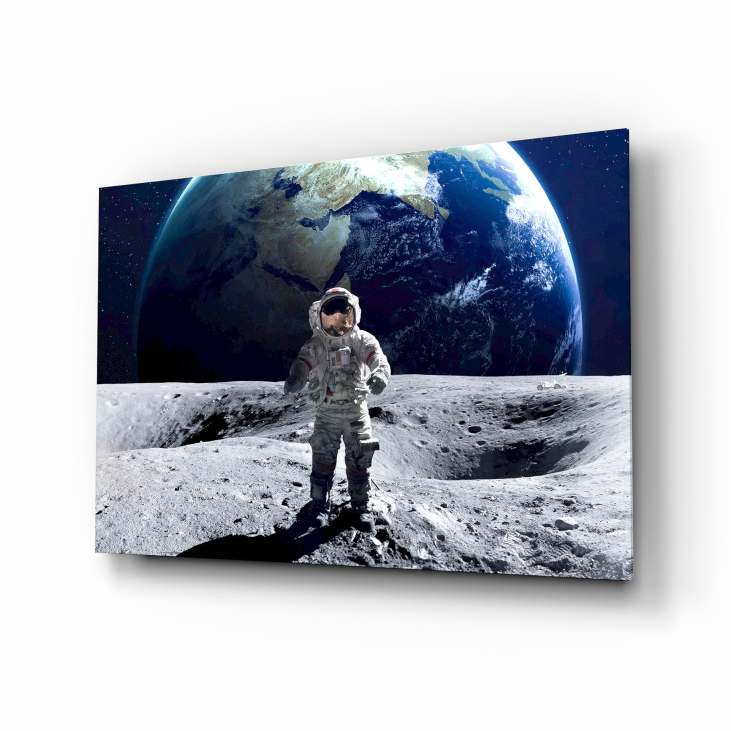 Astronaut in white spacesuit standing on lunar surface with Earth rising behind, displayed as glass wall art with 3D perspective effect.