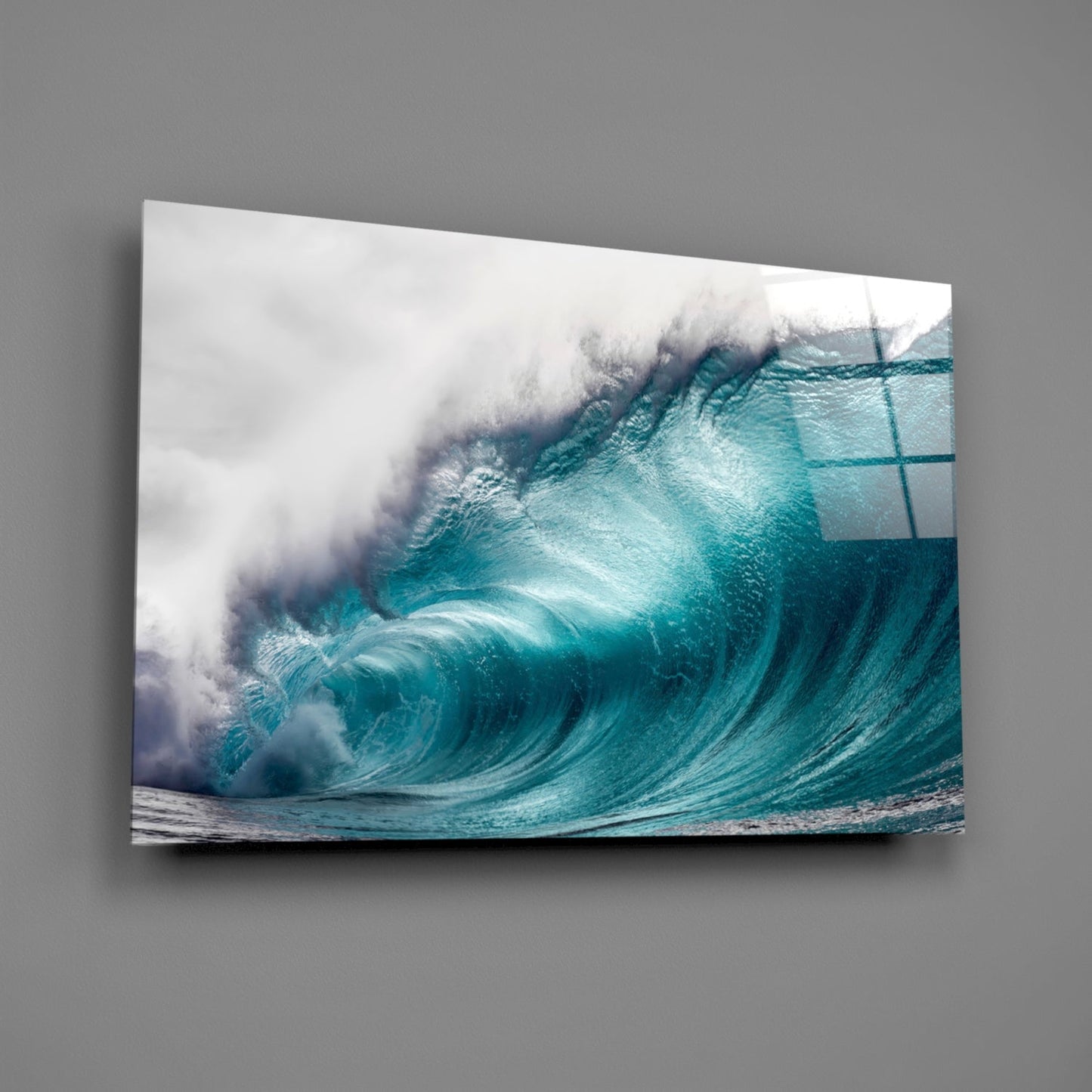 Large turquoise wave with white foam crashing, mounted as glass wall art against gray background.