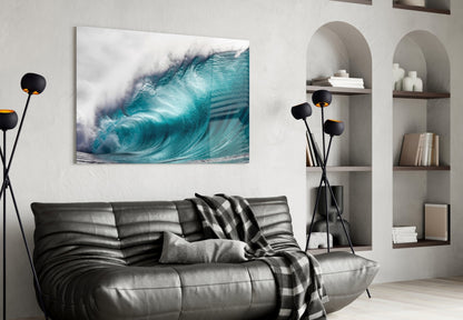 Modern living room with turquoise wave glass wall art above black leather sofa and white archway shelving.