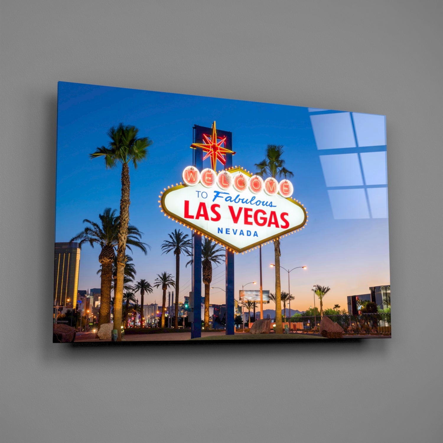 Glass wall art displaying the iconic Las Vegas welcome sign at dusk with palm trees and neon lights.