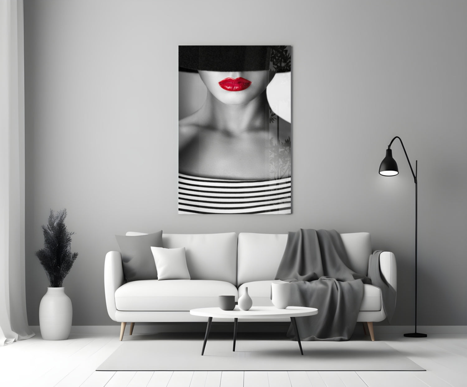 Red Lips Portrait glass wall art hanging above white sofa in minimalist monochrome living room interior.