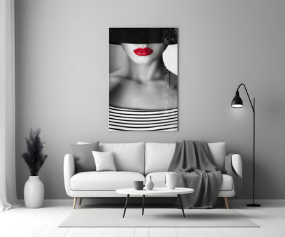 Red Lips Portrait glass wall art hanging above white sofa in minimalist monochrome living room interior.