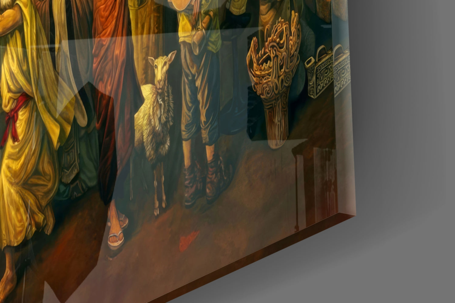 Close-up angle of illuminated glass wall art showing robed figures in gold and red garments with decorative ornamental details and scrollwork.