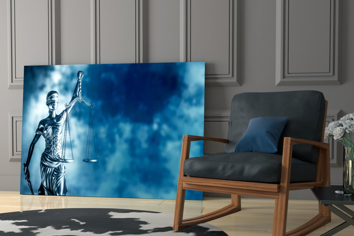 Glass wall art featuring Lady Justice statue with scales against blue cloudy background, displayed in modern room setting next to wooden chair.