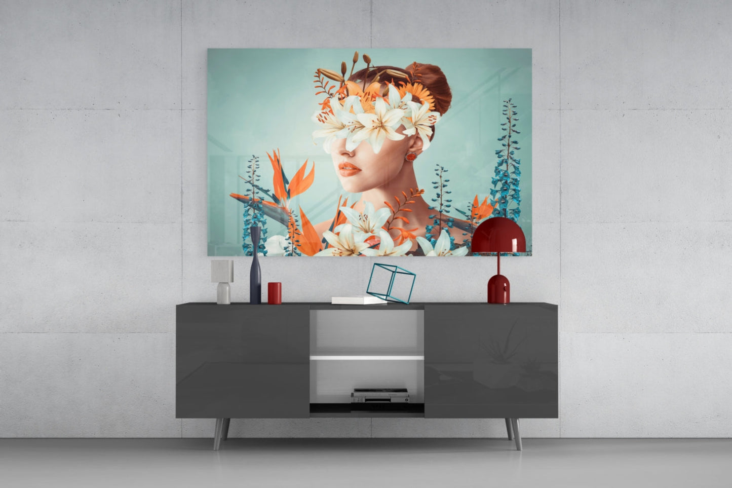 Modern living room with turquoise and orange floral abstract glass art displaying woman's profile above dark media console.