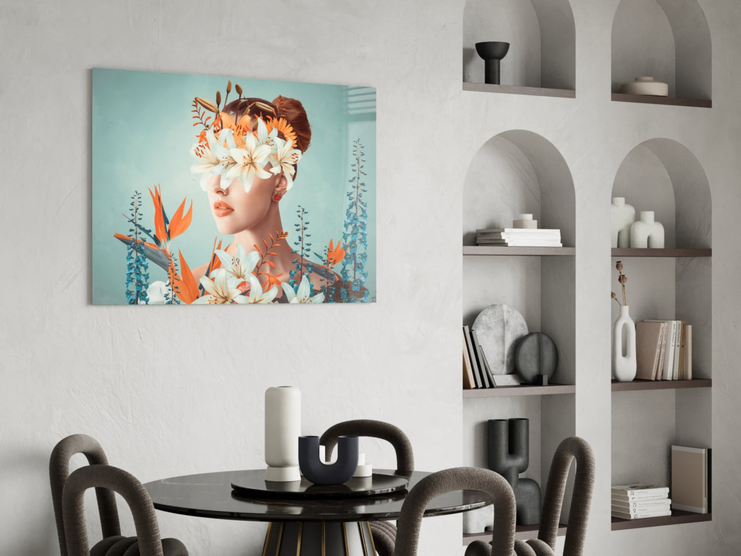 Modern dining room interior with turquoise glass art depicting woman's face surrounded by orange and white flowers on wall above black table.