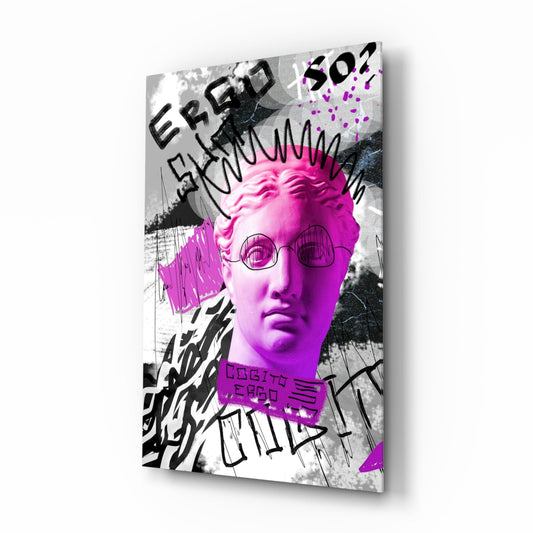Angled view of glass wall art featuring a neon pink classical bust with round glasses, black graffiti text, and abstract line drawings on grayscale background.