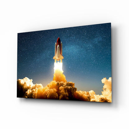 Space shuttle launching through orange clouds against starry sky on glass wall art panel.