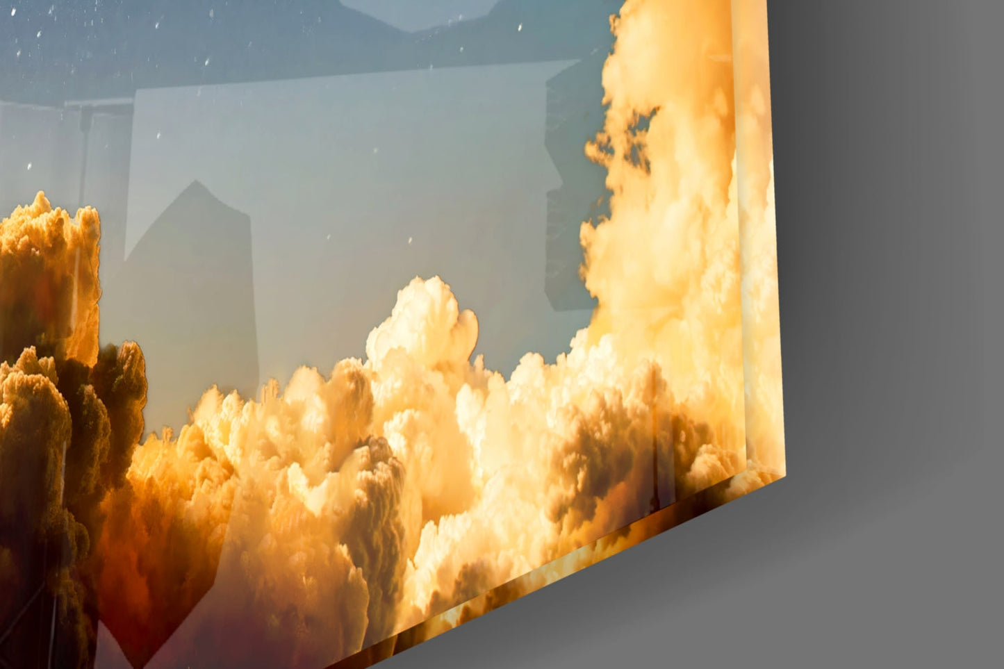 Golden clouds and atmospheric cityscape printed on translucent glass panel displayed at an angled perspective.
