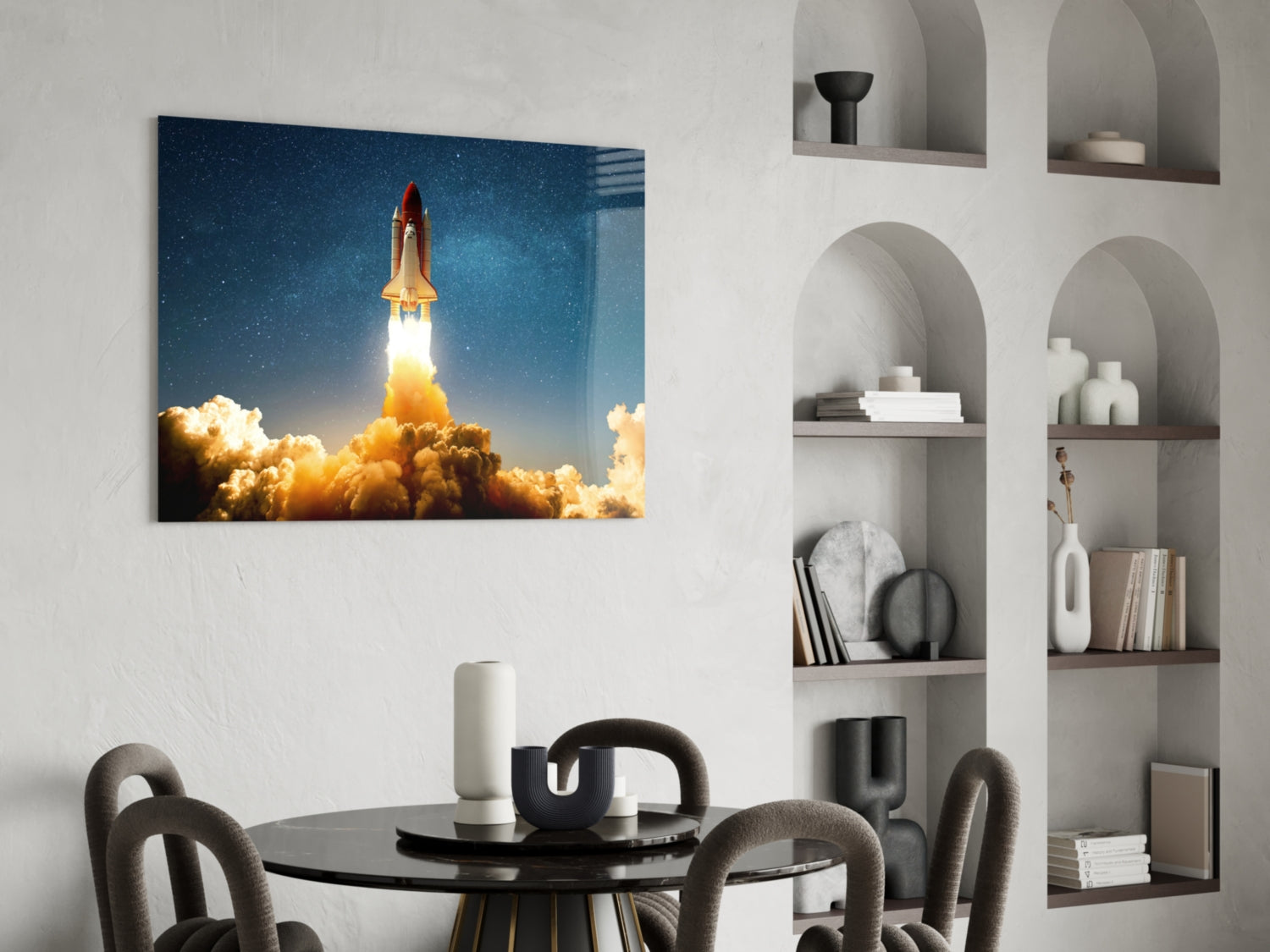 Space shuttle launching through golden clouds against starry blue sky displayed on glass wall art in modern dining room setting.