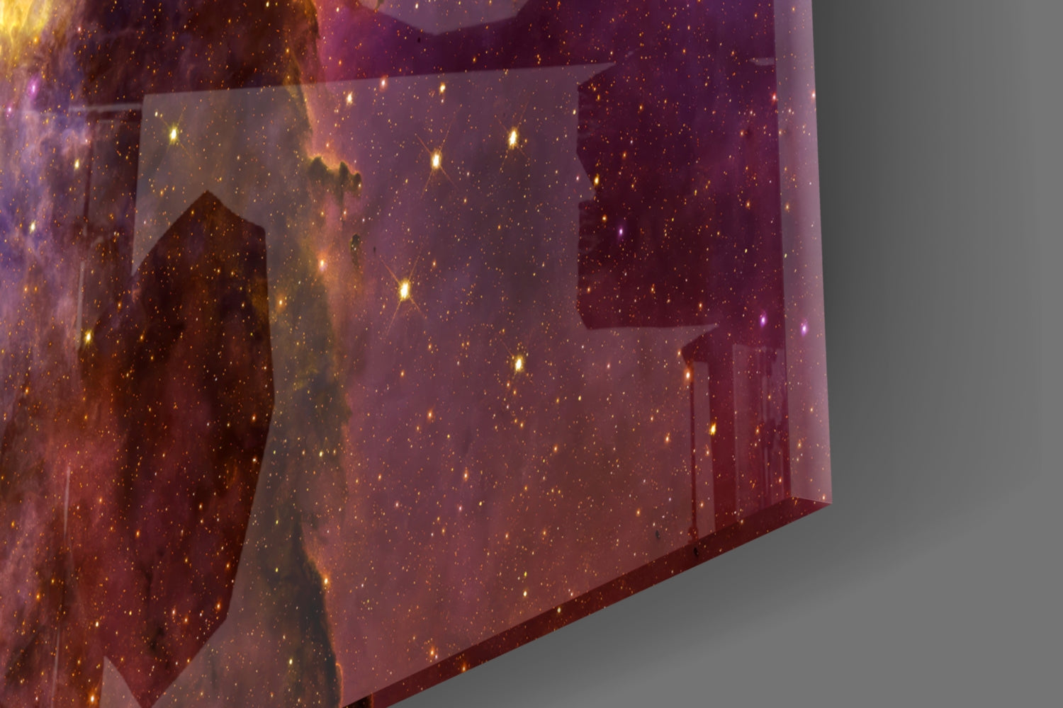 Tilted close-up view of translucent lilac glass panel with gold-speckled starfield and amber-lit architectural silhouettes.