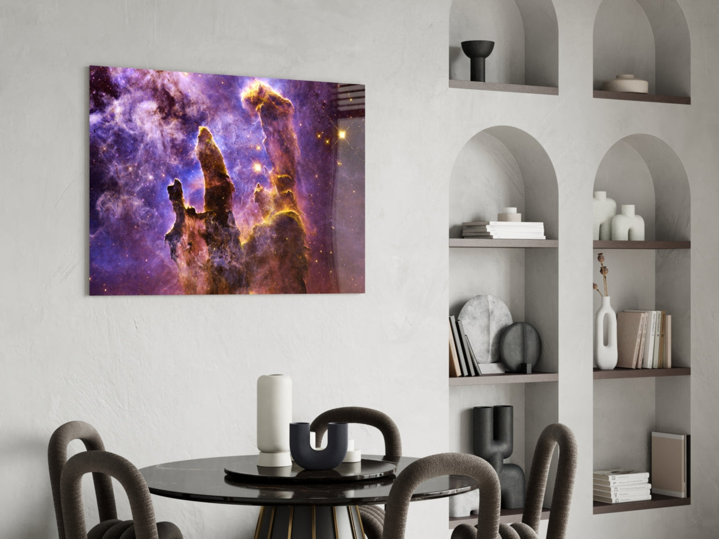 Space Lilac Glass Wall Art displaying purple nebula with golden pillars hung above black dining table in modern interior.