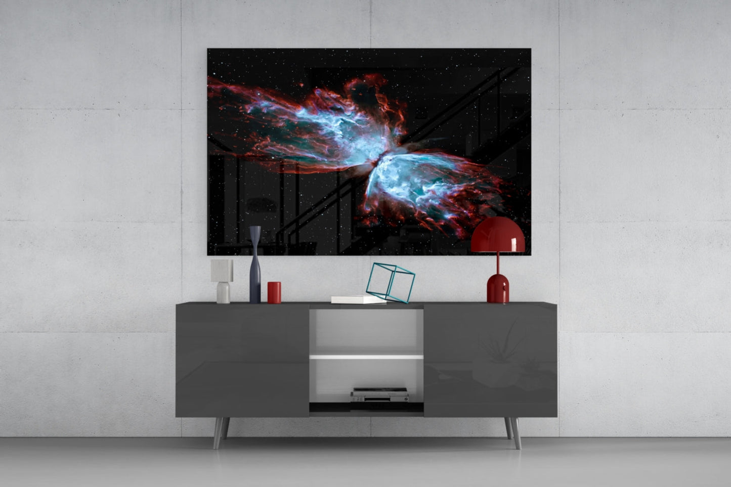 Modern living room with Space Red Glass Wall Art displaying a nebula with blue and red cosmic clouds mounted above a gray media console.