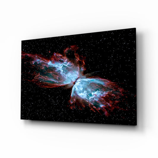 Angled perspective of a black glass panel displaying a red and blue nebula with stellar jets against a starfield background.