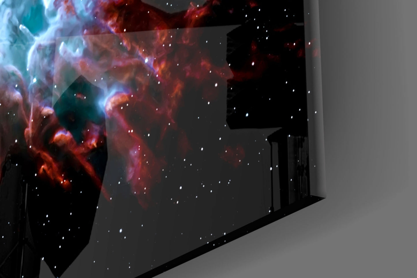 Red and blue nebula glass wall art installed in corner of modern room, displaying cosmic cloud patterns with stars.