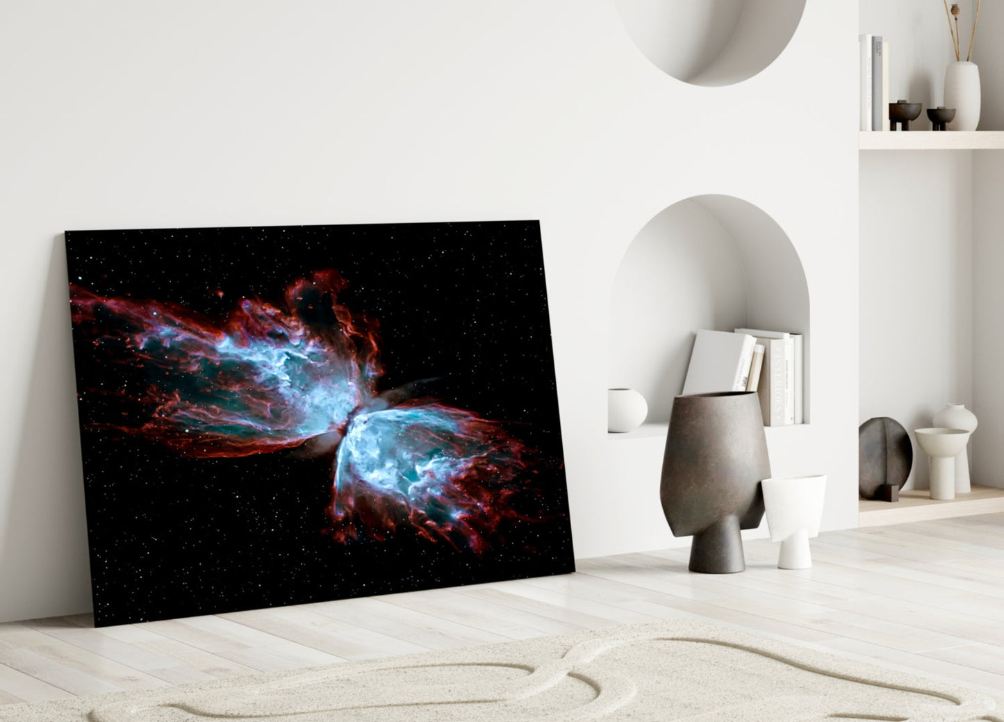 Space Red Glass Wall Art leaning against white wall in minimalist interior with decorative objects and shelving.