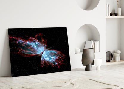 Space Red Glass Wall Art leaning against white wall in minimalist interior with decorative objects and shelving.