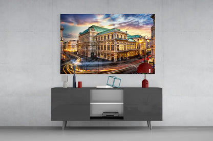 Vienna State Opera House glass wall art displayed above a dark gray media console in a modern living room setting.