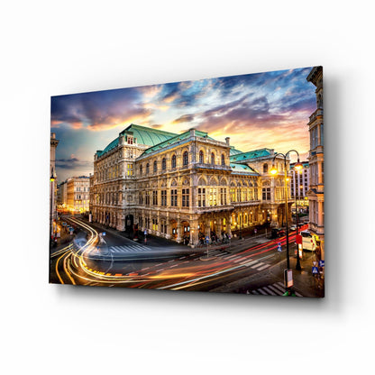 Vienna State Opera building illuminated at dusk with light trails from traffic on glass wall art.
