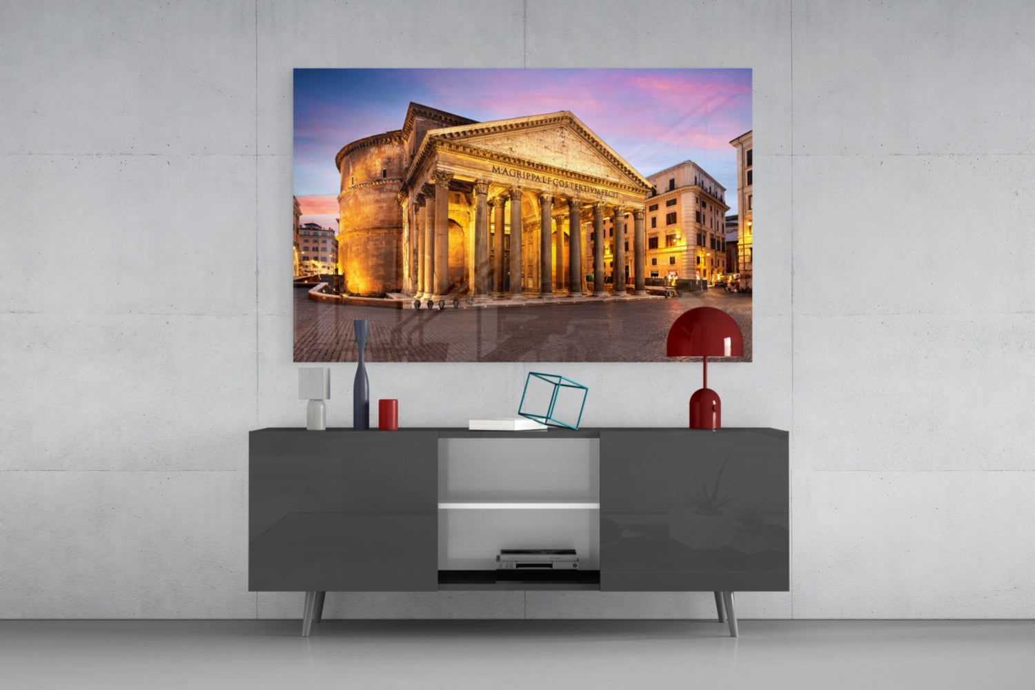 Pantheon Glass Wall Art mounted above gray media console, displaying illuminated ancient Roman temple at dusk with golden columns and pink sky.