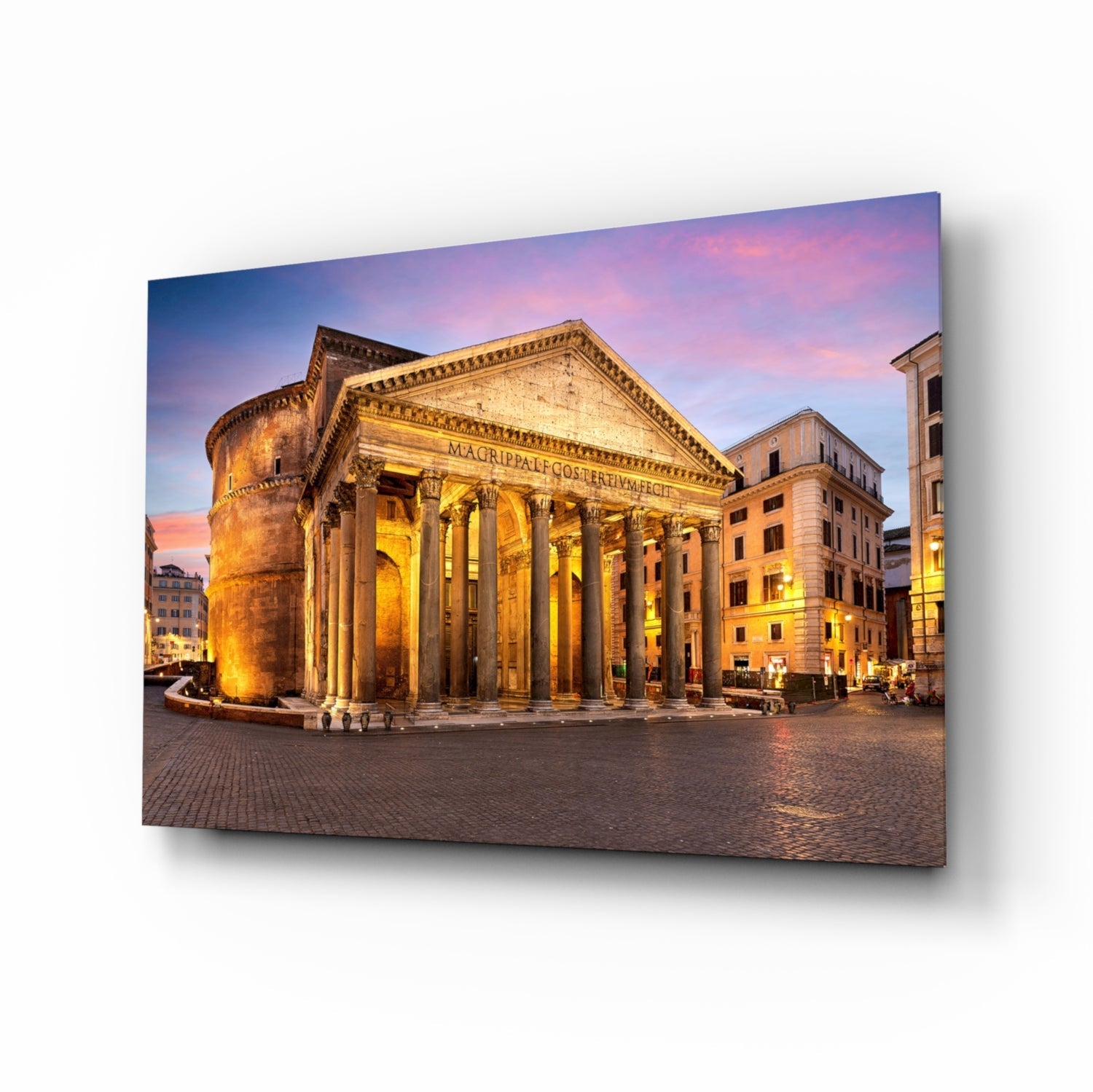 The Pantheon illuminated at twilight with golden columns, surrounding plaza, and pink-purple sky, displayed as angled glass wall art.