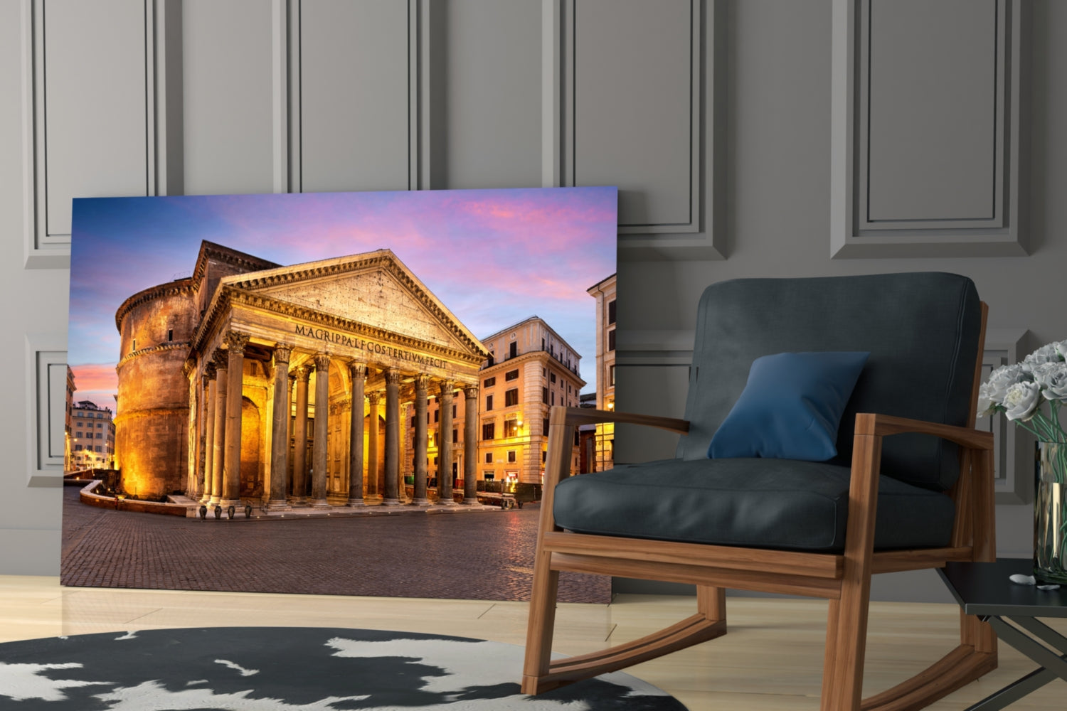 Pantheon glass wall art displaying illuminated Roman temple at twilight, hung in modern living room beside wooden chair.