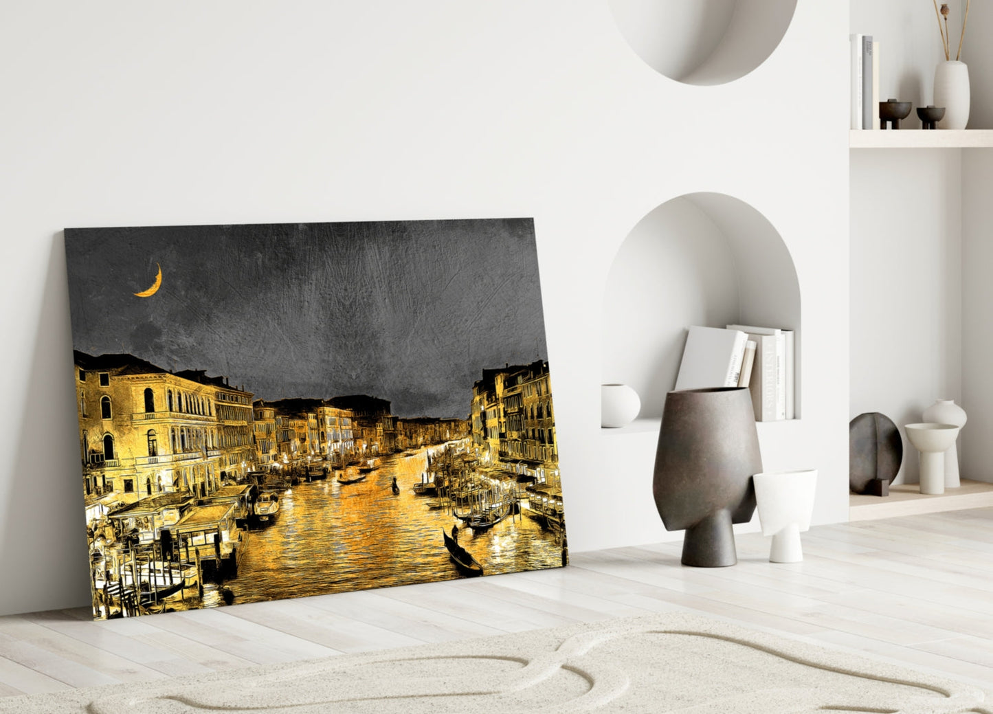 Canvas art depicting Venice's Grand Canal at night with golden-lit buildings, dark sky, and crescent moon, leaning against white interior wall with decorative objects.