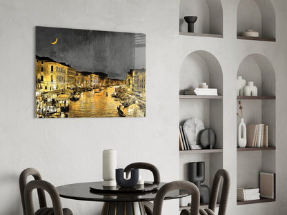 Venetian Glass Wall Art depicting a golden-lit canal at night with crescent moon, displayed above a black dining table in a modern interior with white shelving.