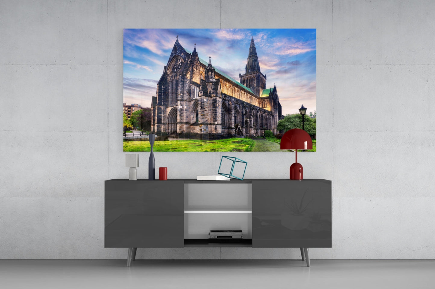 Glasgow Cathedral glass wall art displayed above a dark grey media console in a minimalist interior setting.