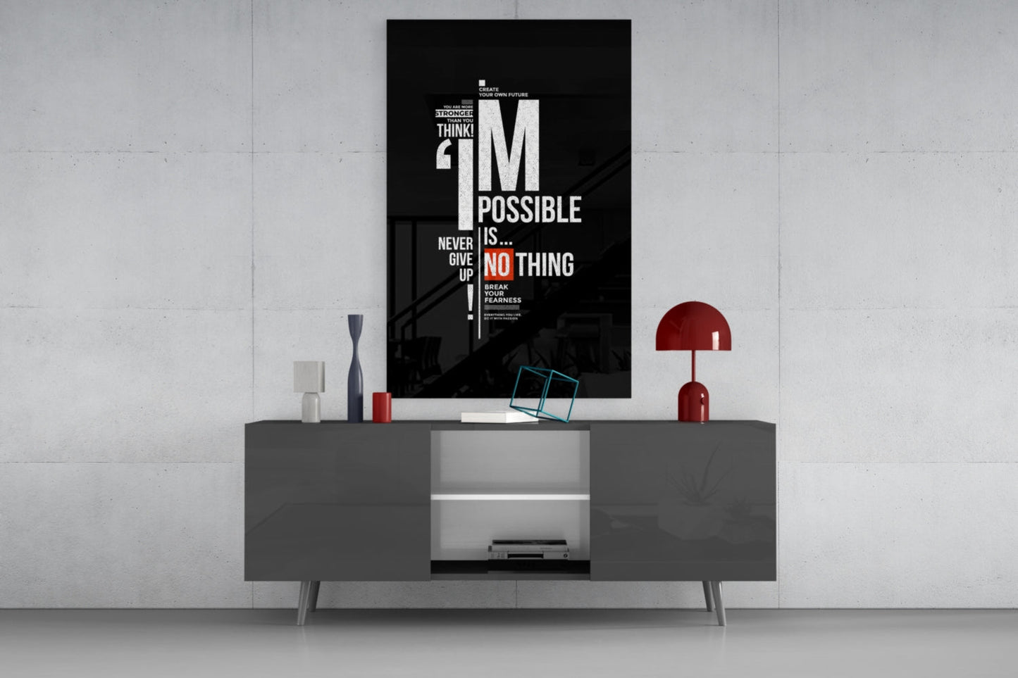 Black motivational glass wall art with white and red text displaying "I'm Possible" and "Never Give Up" mounted above a gray media console.