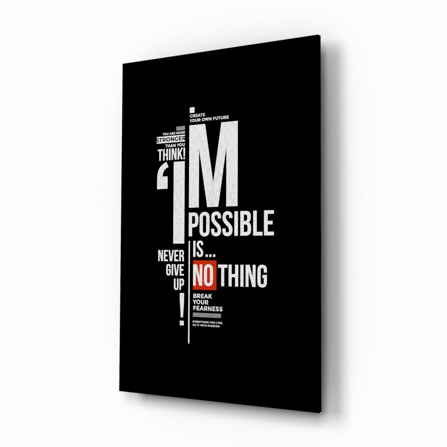 Black glass motivational wall art panel displaying white and red text with inspirational quotes, shown at an angled perspective against white background.