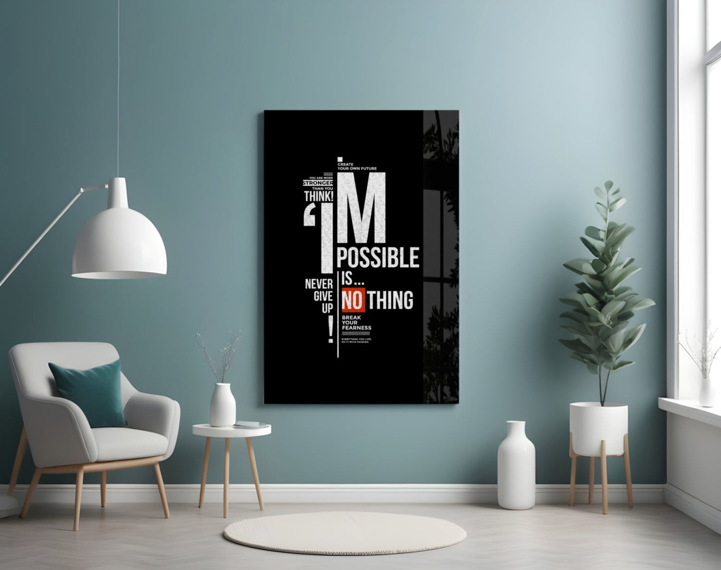 Black motivational glass wall art displaying white and red text reading "I'm Possible Is Nothing" mounted above a cream armchair in a teal room.