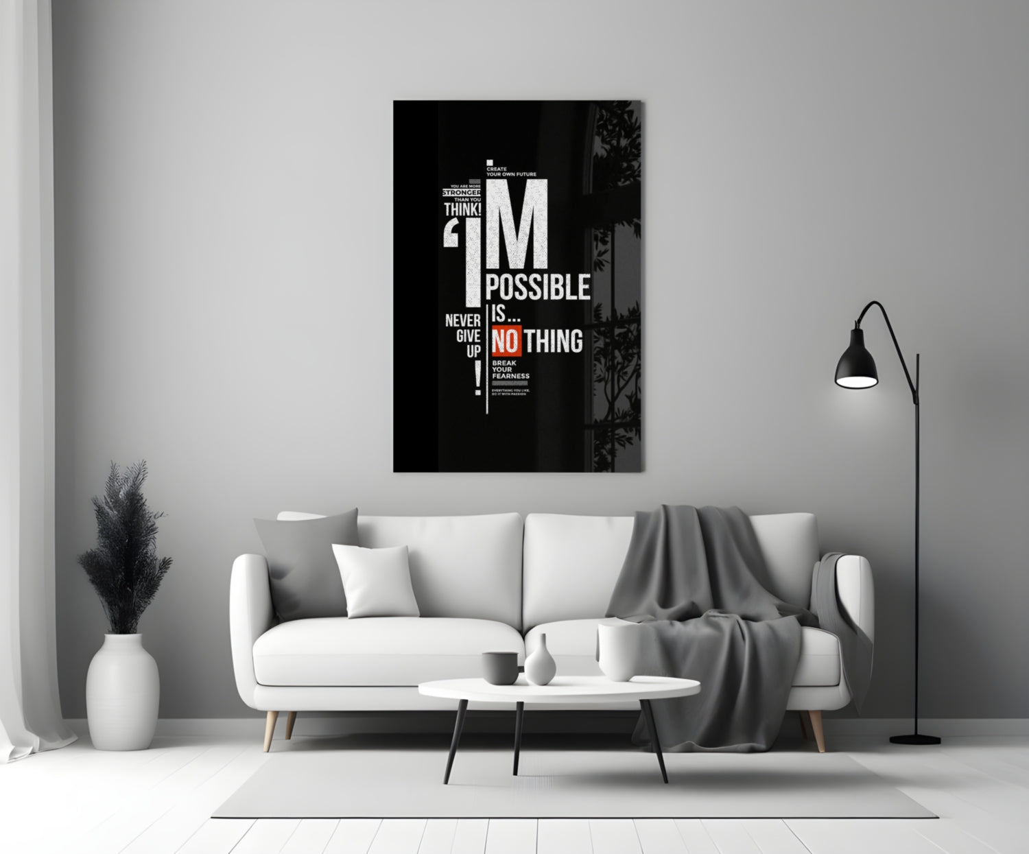 Black motivational glass wall art with white and red text reading "I'm Possible is Nothing" displayed above a white sofa in a minimalist living room.