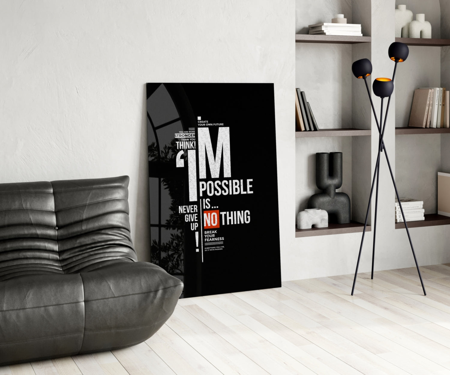 Black motivational glass wall art displaying white and orange text reading "I'm Possible Is... Never Give Up" in a modern living room setting.