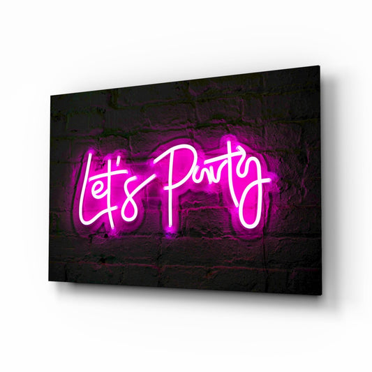 Magenta neon "Let's Party" text glowing against dark brick wall, displayed on angled canvas panel.