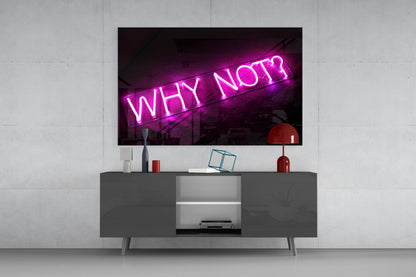 Magenta neon "Why Not?" glass wall art mounted above gray media console in modern living room setting.