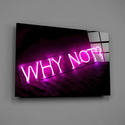 Magenta neon "Why Not?" sign mounted on dark textured wall behind angled glass panel, photographed at three-quarter view.