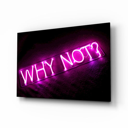 Magenta neon "WHY NOT" text glowing on black glass wall art mounted at an angle against white background.