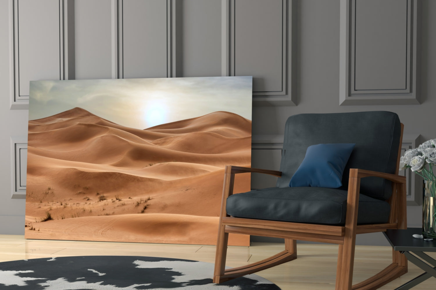 Desert View Glass Wall Art depicting sandy dunes and bright sun displayed in modern living room beside wooden chair.