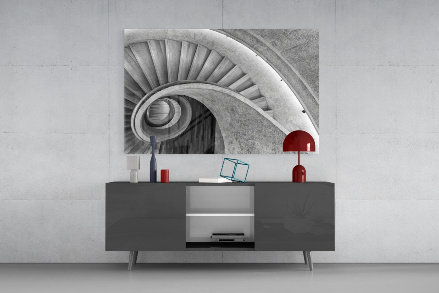 Black and white spiral staircase photograph displayed above dark gray media console with red decorative accents.