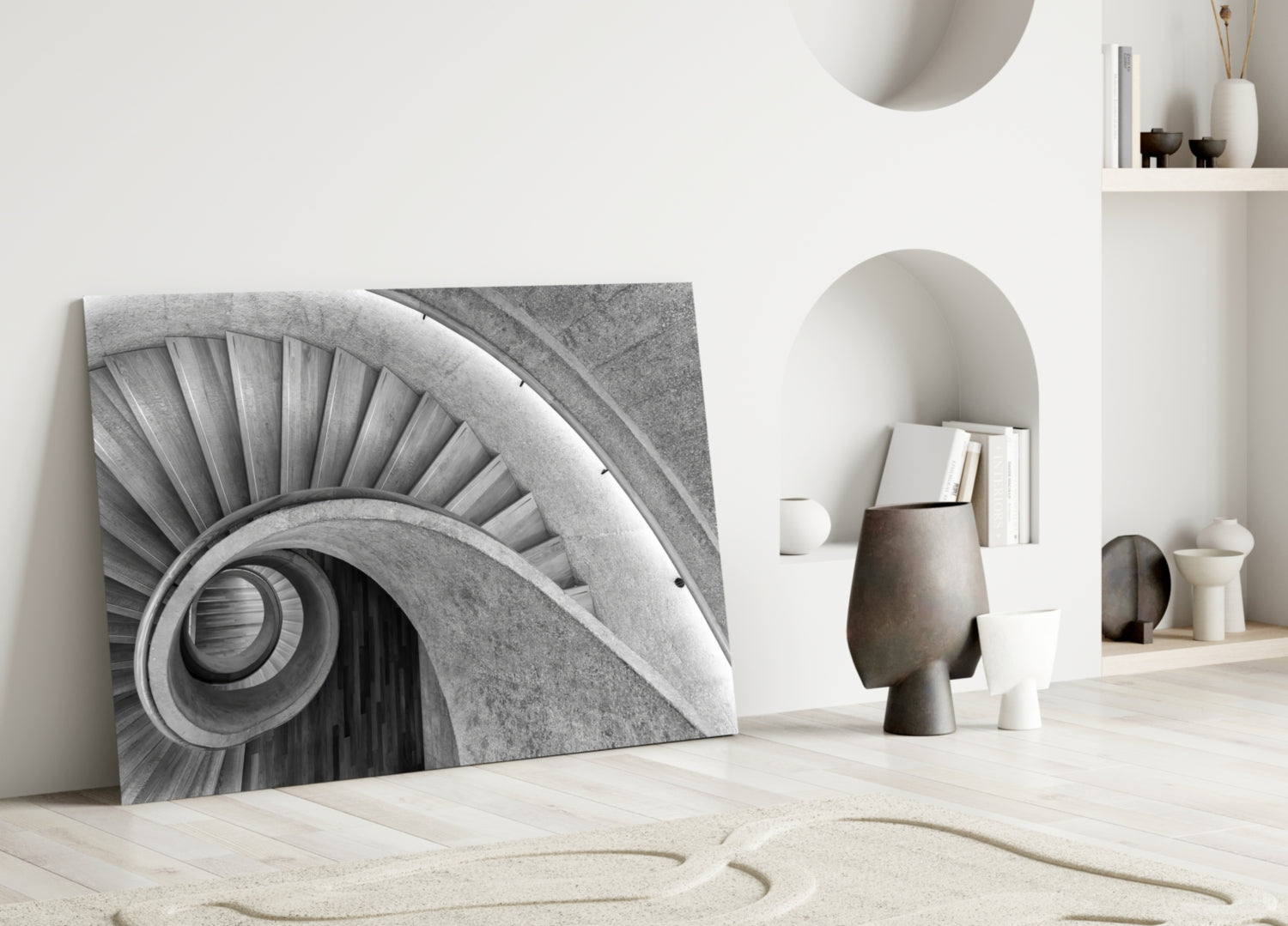Monochrome architectural glass art leaning against white wall displaying spiraling column detail with geometric background.